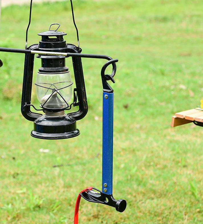 Camping Hammer MS531956 Huntar designed with a hook for hanging lanterns, illustrating its multi-functional use in outdoor settings.
