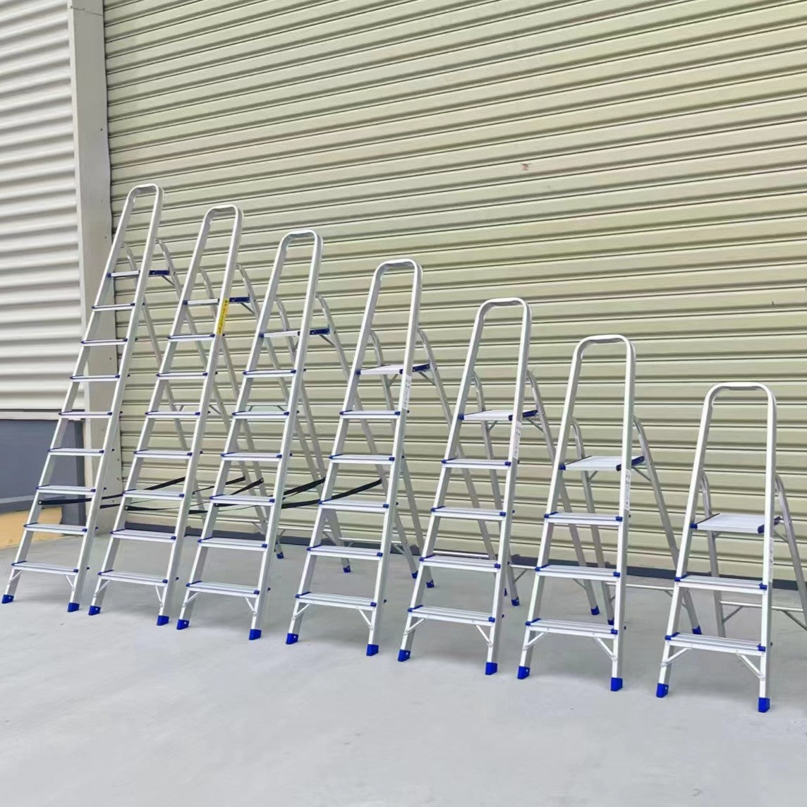 Multiple Ladder Aluminum Soma units displaying various step counts, showcasing versatility for different heights and project needs.