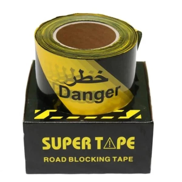 SuperTape Warning Tape Yellow/Black 'Danger' roll displayed in packaging, designed for high-visibility hazard marking in professional environments.