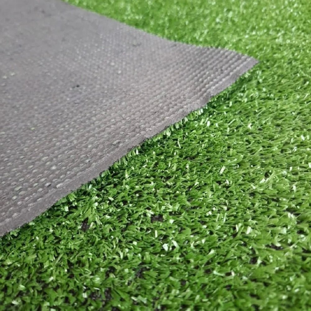 Close-up view of the Grass Artificial Carpet 10mm, showcasing the realistic green blades and textured backing of the 4M x 25M carpet, perfect for enhancing outdoor spaces.