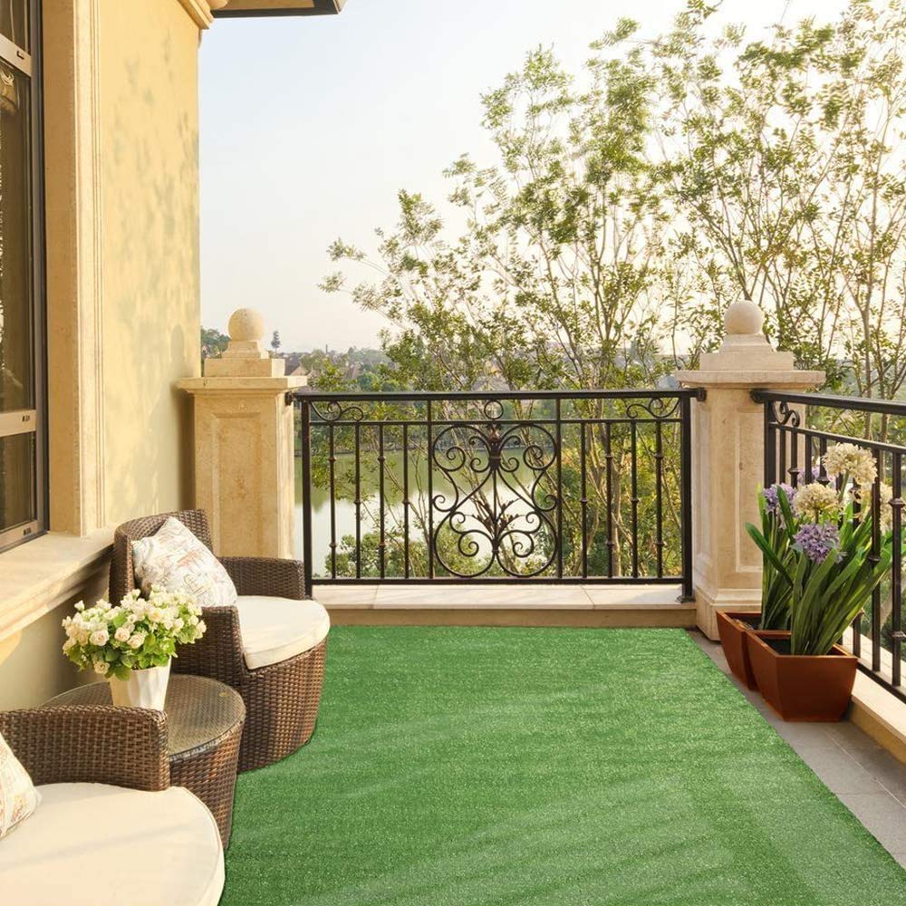 Grass Artificial Carpet 10mm (4M x 25M) showcased on a balcony, illustrating a natural-looking lawn with beautiful scenery in the background.