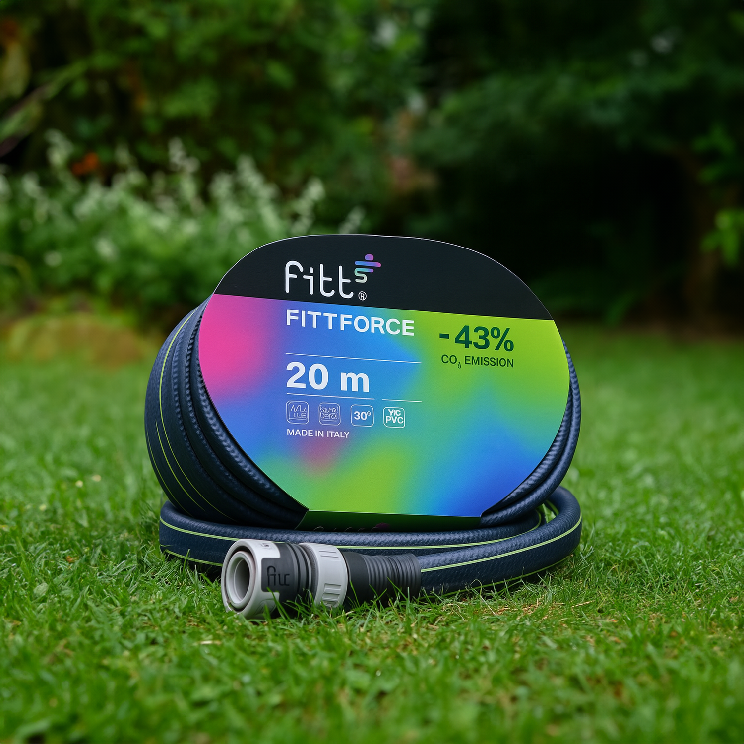 FITT Force garden hose, 20 meters, made in Italy, displayed on green grass, showcasing eco-friendly features with a colorful label highlighting 43% CO emission reduction.