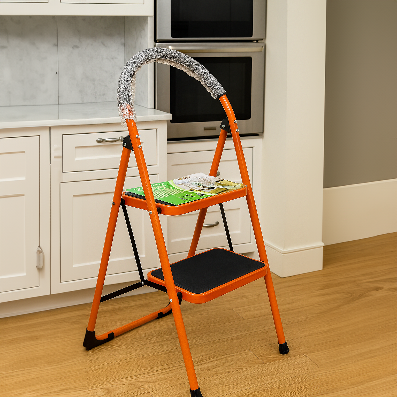Heavy-Duty Ladder 2-Step by SOMA, featuring a sturdy design with two steps and a multi-purpose tool tray, positioned in a modern kitchen setting.