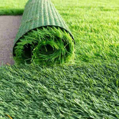 Artificial Grass Roll 50mm displayed in a lush, green outdoor setting, showcasing its realistic texture and low-maintenance features, measuring 2M x 25M.